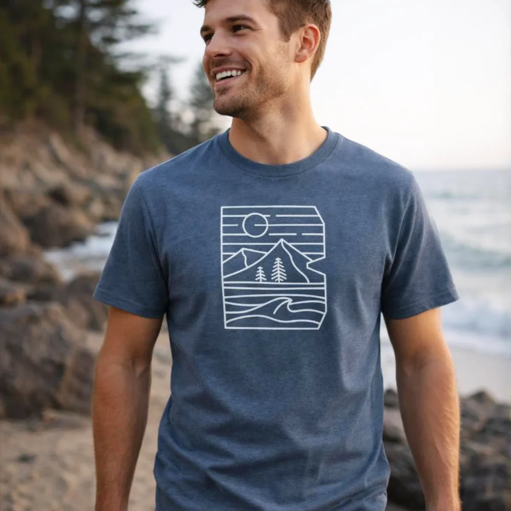 Man wearing beyond organic cotton unisex dark heather blue tshirt